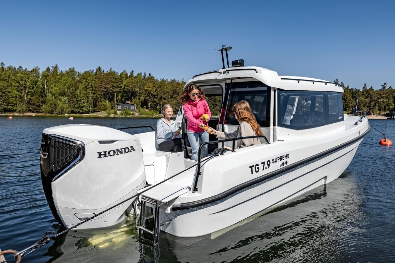 Family enjoying a ride on the 2025 TG 7.9 Supreme boat with Honda engine.