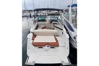 2014 Cobalt 26SD boat docked at marina, featuring spacious seating and sleek design.