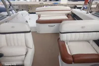 2014 Cobalt 26SD boat interior with white and brown leather seating.