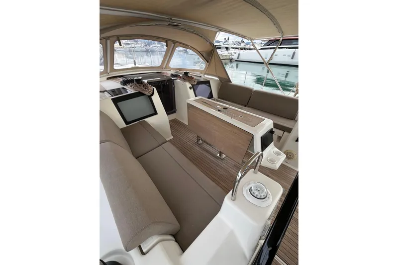 La Rosa 2 Yacht Photos Pics Interior view of 2017 Dufour 460 GL yacht with seating and navigation equipment.