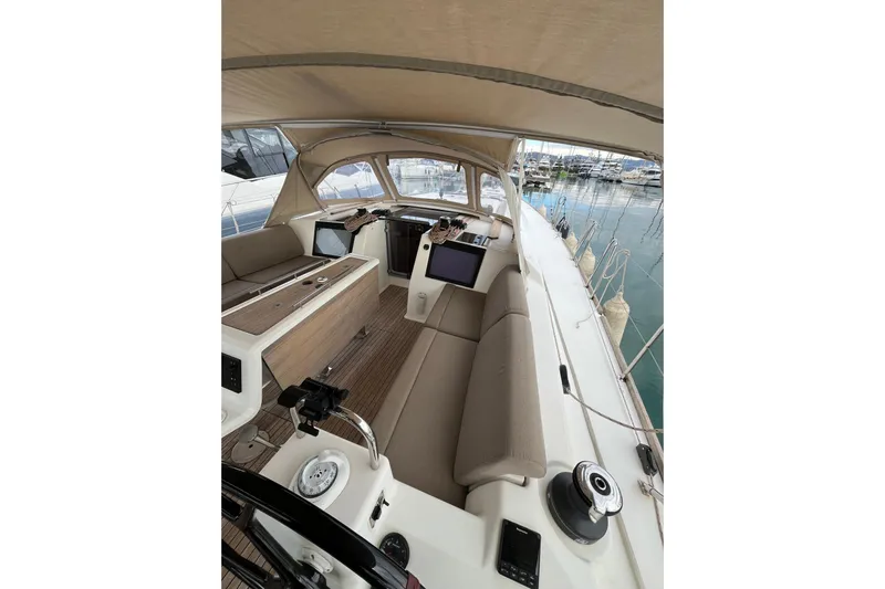 La Rosa 2 Yacht Photos Pics Spacious cockpit of 2017 Dufour 460 GL sailboat with modern amenities and seating.