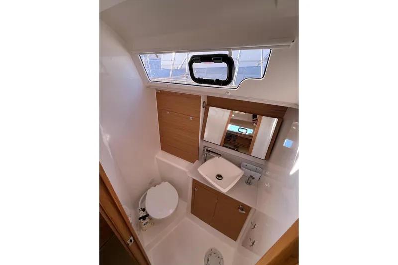 La Rosa 2 Yacht Photos Pics 2017 Dufour 460 GL yacht bathroom with sink, toilet, and window.