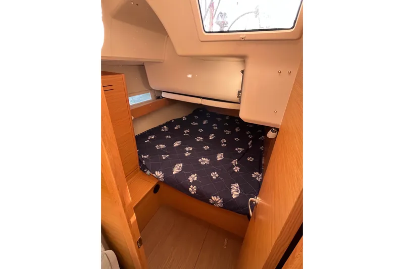 La Rosa 2 Yacht Photos Pics Cozy cabin interior of 2017 Dufour 460 GL sailboat with floral bedding.
