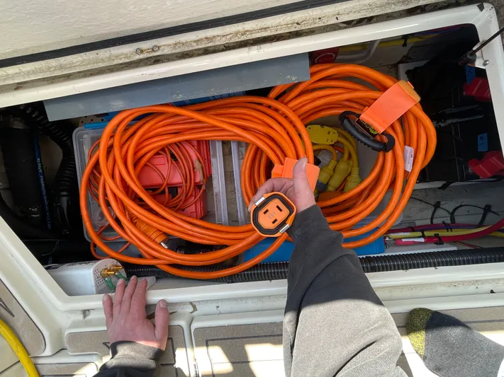 Shutter Speed II Yacht Photos Pics Electrical cables in storage compartment of a 2022 Ranger Tugs R-31 CB boat.
