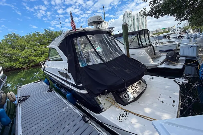 Sophia Yacht Photos Pics 2015 Regal 38 Express yacht docked at marina with cityscape background.