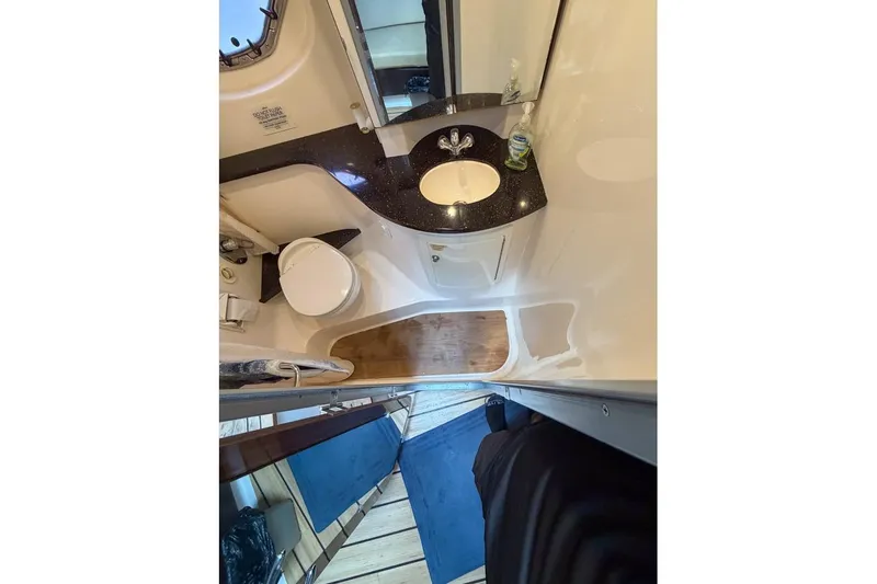 Sophia Yacht Photos Pics Bathroom interior of 2015 Regal 38 Express yacht with sink and toilet.