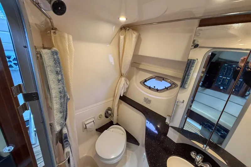 Sophia Yacht Photos Pics 2015 Regal 38 Express yacht bathroom with modern fixtures and porthole window.