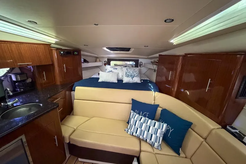 Sophia Yacht Photos Pics Luxurious interior of 2015 Regal 38 Express yacht with cozy seating and modern amenities.
