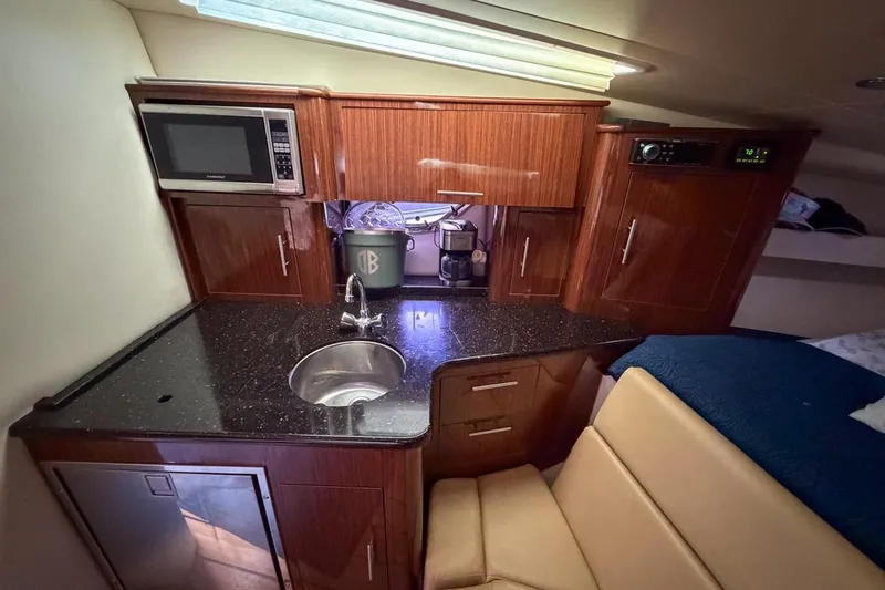 Sophia Yacht Photos Pics Luxurious 2015 Regal 38 Express yacht interior with kitchenette and modern amenities.
