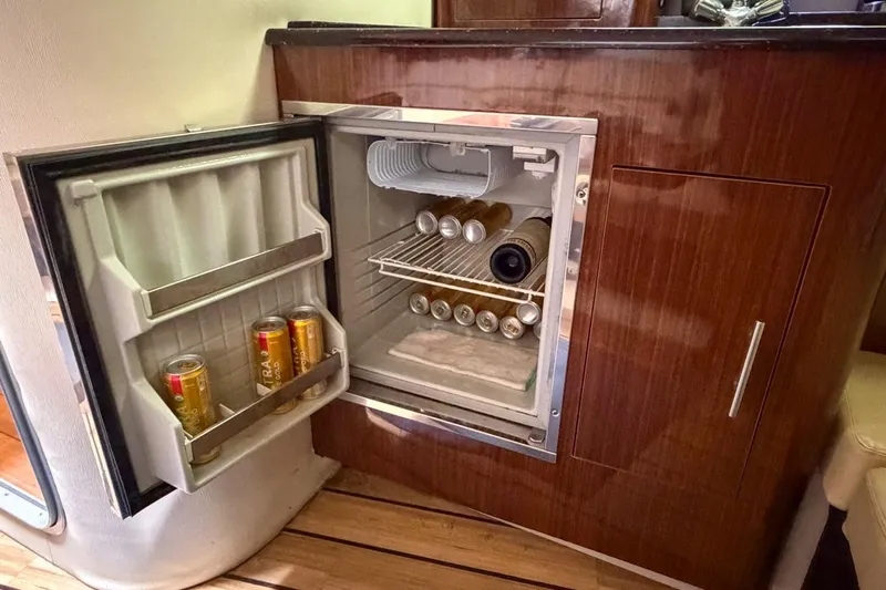 Sophia Yacht Photos Pics Mini fridge stocked with drinks inside a 2015 Regal 38 Express yacht.