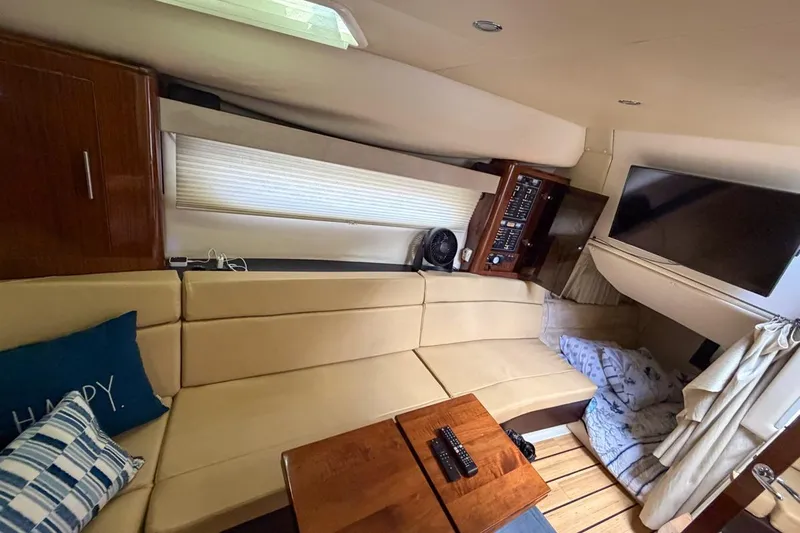 Sophia Yacht Photos Pics Luxurious interior of 2015 Regal 38 Express yacht with beige seating and modern amenities.