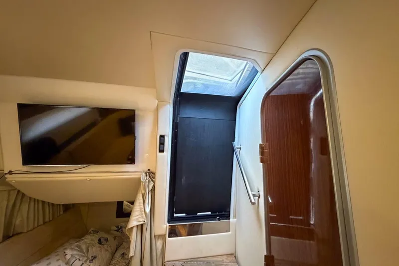 Sophia Yacht Photos Pics Interior of 2015 Regal 38 Express yacht with TV and skylight.