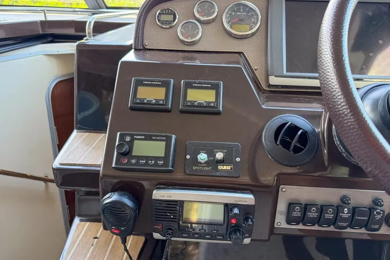 Sophia Yacht Photos Pics Control panel of a 2015 Regal 38 Express boat with various instruments and gauges.