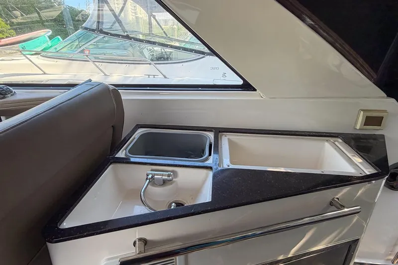 Sophia Yacht Photos Pics Interior view of 2015 Regal 38 Express yacht with sink and countertop.