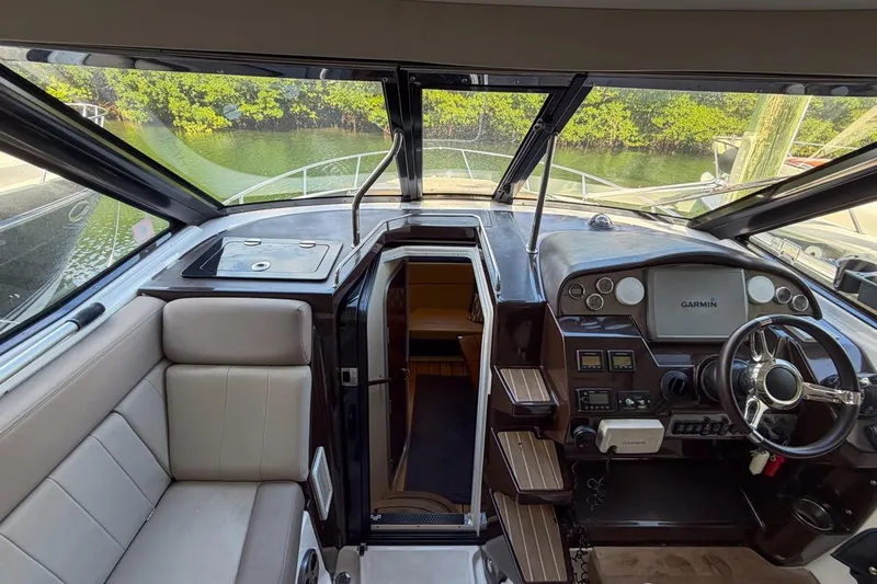 Sophia Yacht Photos Pics 2015 Regal 38 Express yacht interior with helm, seating, and navigation equipment.