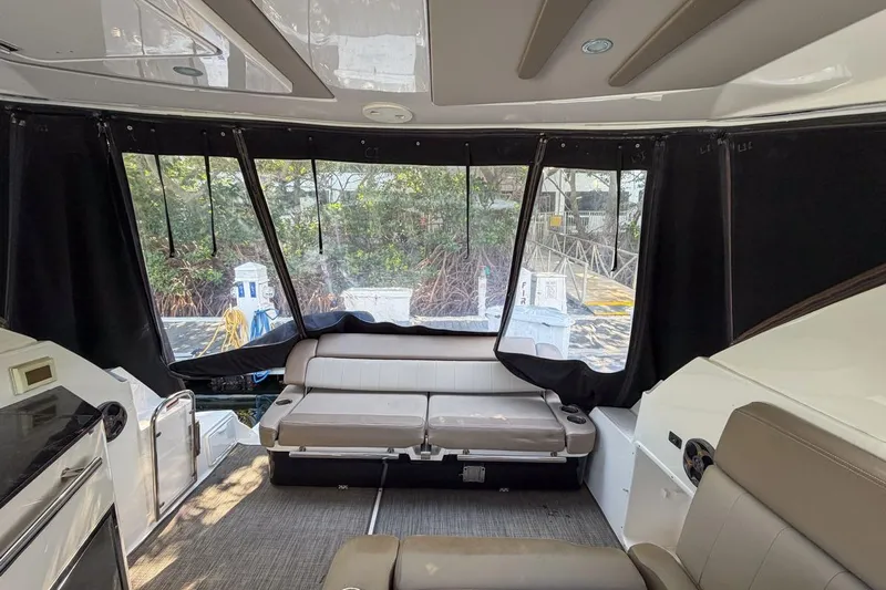 Sophia Yacht Photos Pics Interior of 2015 Regal 38 Express yacht with seating and windows.