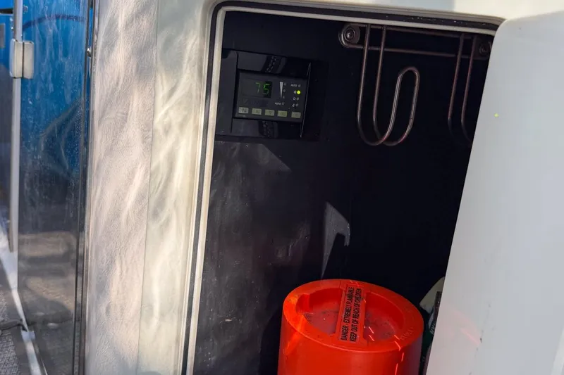 Sophia Yacht Photos Pics Interior of 2015 Regal 38 Express yacht with control panel and safety equipment.