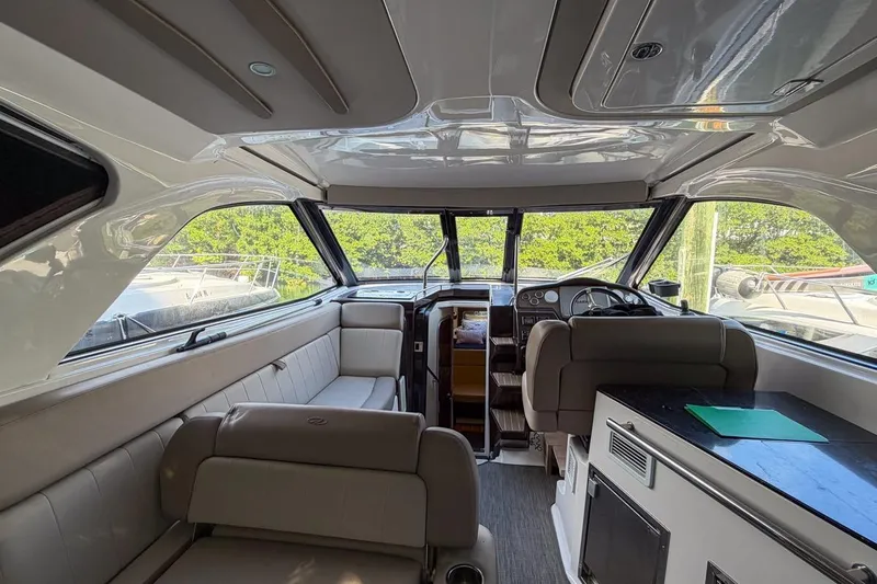 Sophia Yacht Photos Pics Interior of 2015 Regal 38 Express yacht, featuring seating and helm station.