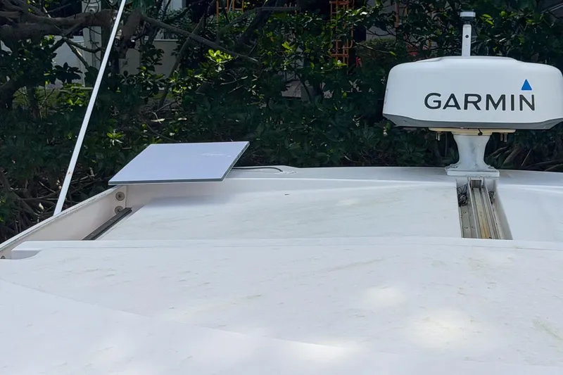 Sophia Yacht Photos Pics 2015 Regal 38 Express boat with Garmin radar and satellite dish on deck.