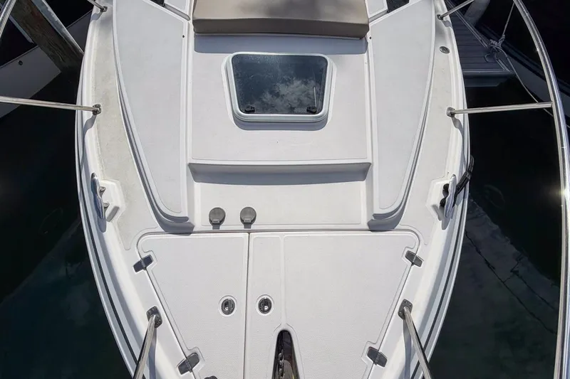 Sophia Yacht Photos Pics 2015 Regal 38 Express boat deck with hatch and railing, viewed from above.