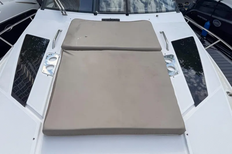 Sophia Yacht Photos Pics 2015 Regal 38 Express boat with cushioned sun deck and cup holders.