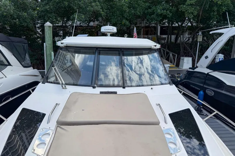 Sophia Yacht Photos Pics 2015 Regal 38 Express boat docked, featuring sleek design and spacious deck.