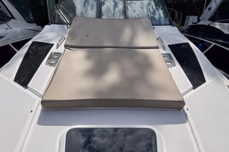 Sophia Yacht Photos Pics 2015 Regal 38 Express boat with sunpad on deck, featuring sleek design and modern amenities.