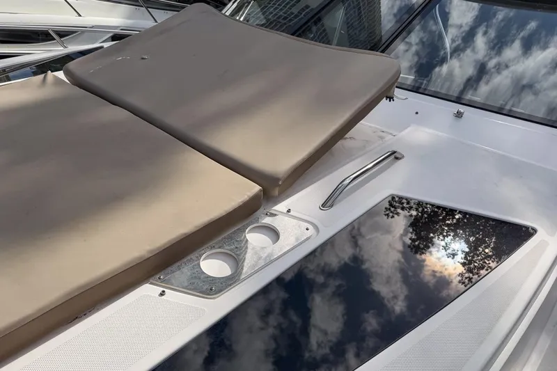 Sophia Yacht Photos Pics 2015 Regal 38 Express boat deck with cushioned seating and cup holders.