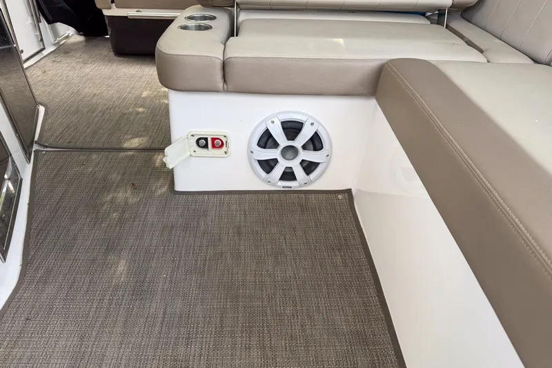 Sophia Yacht Photos Pics Interior of 2015 Regal 38 Express boat with speaker and seating area.