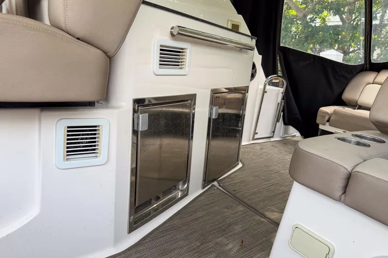 Sophia Yacht Photos Pics Interior of 2015 Regal 38 Express yacht with beige seating and stainless steel fixtures.