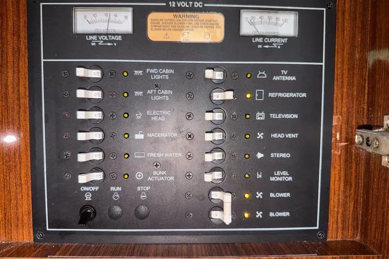 Sophia Yacht Photos Pics Electrical control panel of a 2015 Regal 38 Express boat with labeled switches.