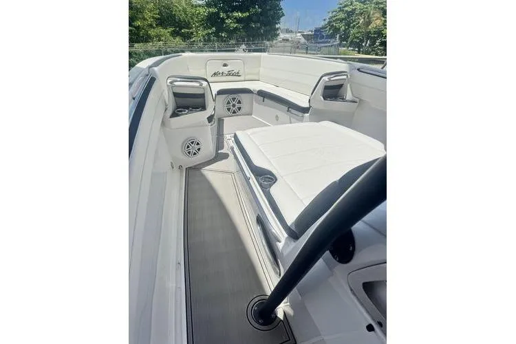 No Name Yacht Photos Pics 2019 Nor-Teck 390 Sport Center Console boat interior with white seating and speakers.