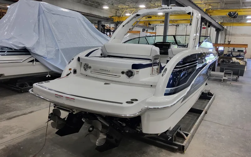  Yacht Photos Pics 2026 Formula 290 Bowrider boat in a workshop, showcasing sleek design and modern features.