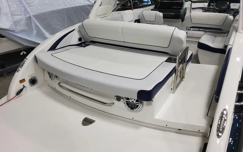  Yacht Photos Pics 2026 Formula 290 Bowrider boat interior with white seating and modern design.