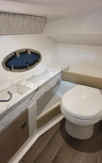  Yacht Photos Pics 2026 Formula 290 Bowrider interior bathroom with modern fixtures and sleek design.