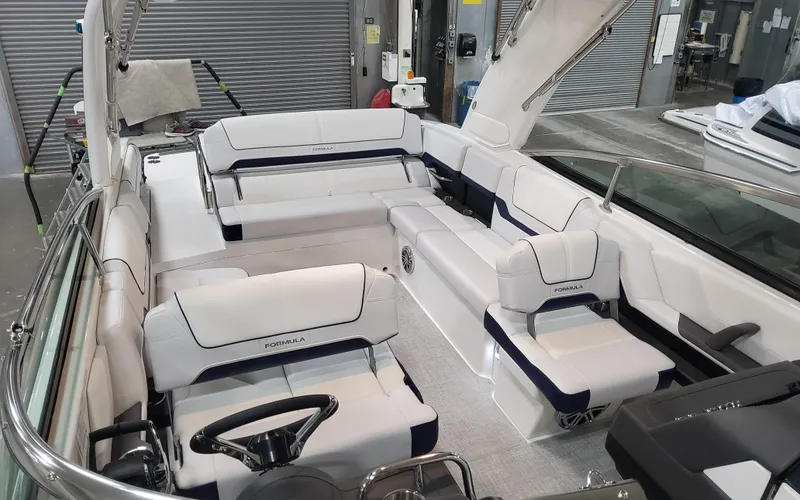  Yacht Photos Pics 2026 Formula 290 Bowrider interior with luxurious white seating and modern design.