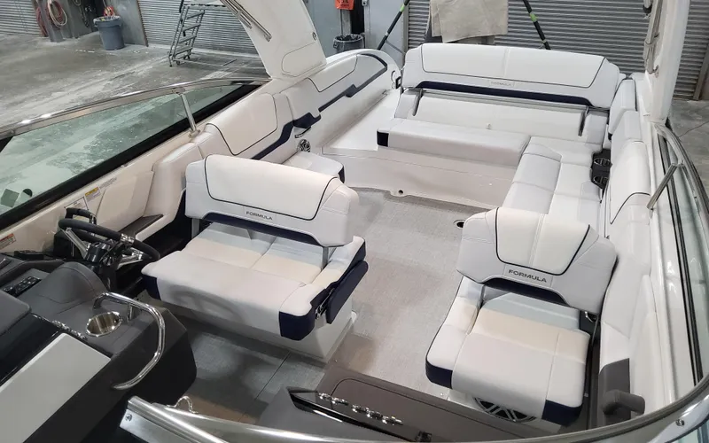  Yacht Photos Pics 2026 Formula 290 Bowrider interior with luxurious white seating and modern design.