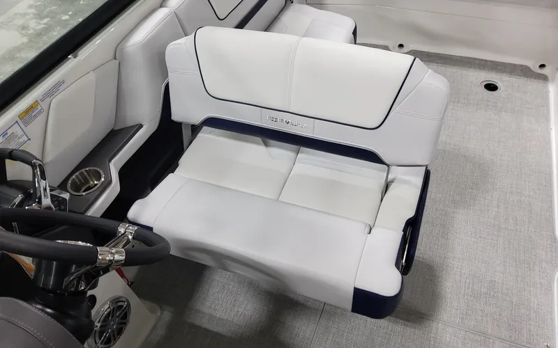  Yacht Photos Pics 2026 Formula 290 Bowrider interior with white seating and steering wheel.