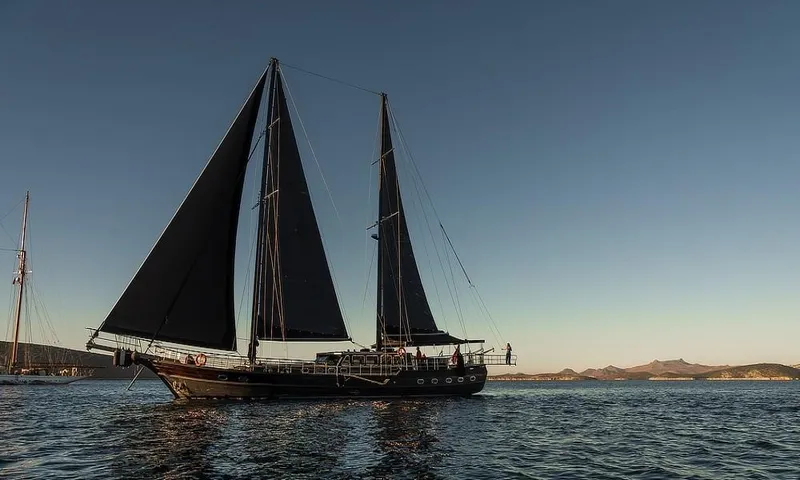 27 M Deluxe Gulet Yacht Photos Pics Custom Made Motorsailor 2003 sailing on calm waters at sunset, with mountains in the background.