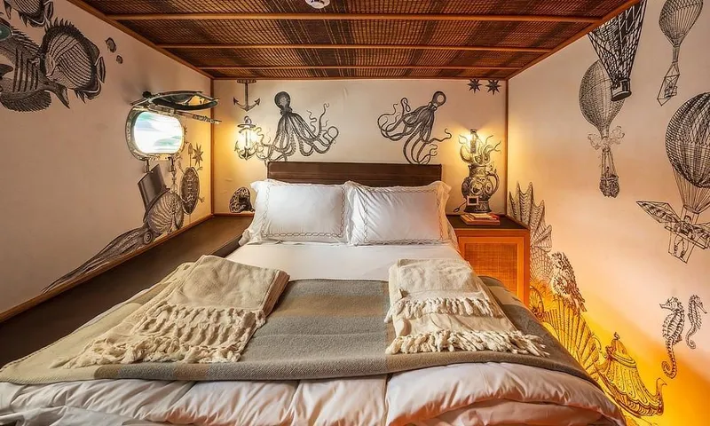 27 M Deluxe Gulet Yacht Photos Pics Cozy bedroom in 2003 custom motorsailor with nautical-themed wall art and porthole window.