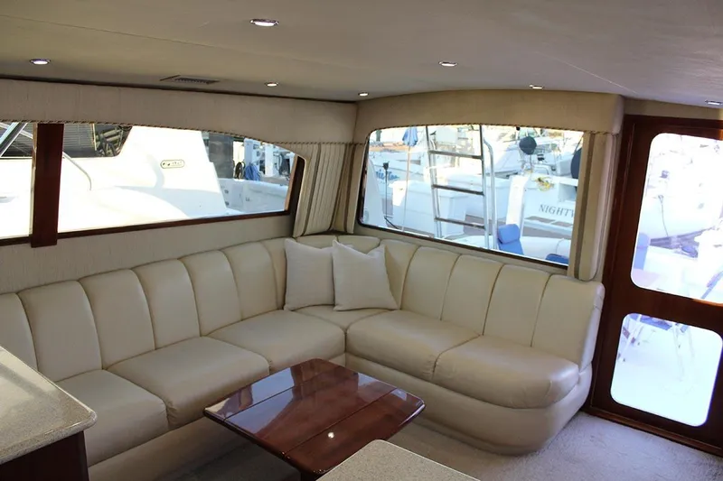 Baby Grand Yacht Photos Pics Luxurious interior of 2006 Egg Harbor 43 Sport Yacht with cream leather seating.