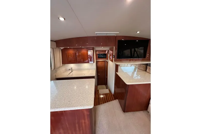 Baby Grand Yacht Photos Pics Interior of 2006 Egg Harbor 43 Sport Yacht with modern kitchen and wood finishes.