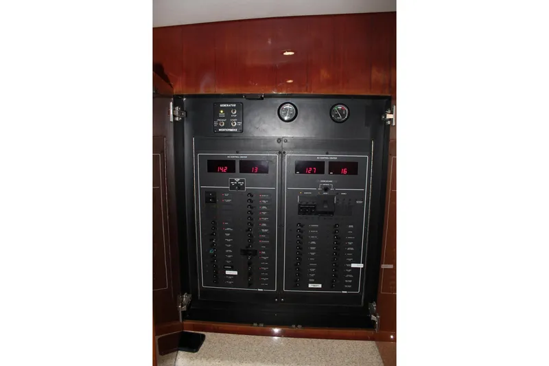 Baby Grand Yacht Photos Pics Electrical control panel on 2006 Egg Harbor 43 Sport Yacht, featuring gauges and switches.