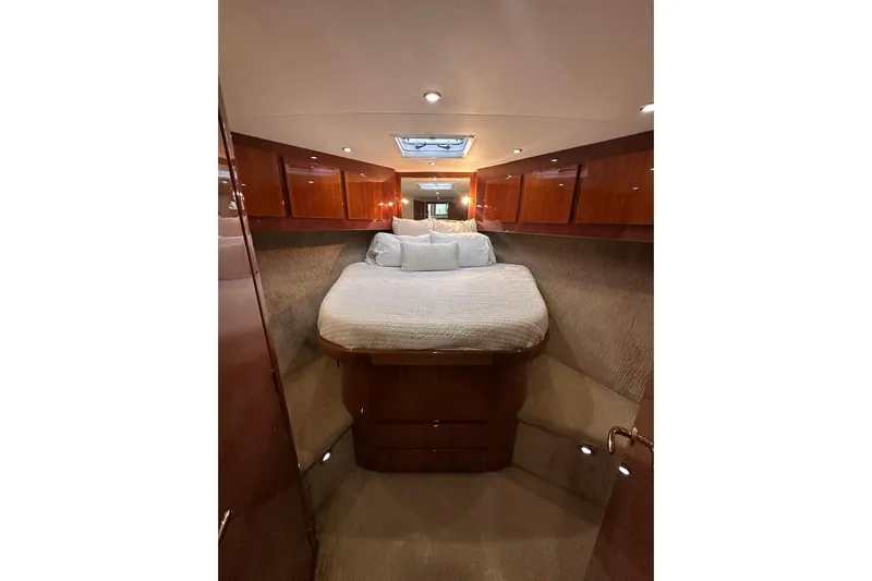 Baby Grand Yacht Photos Pics Luxurious cabin interior of 2006 Egg Harbor 43 Sport Yacht with elegant wood finishes.