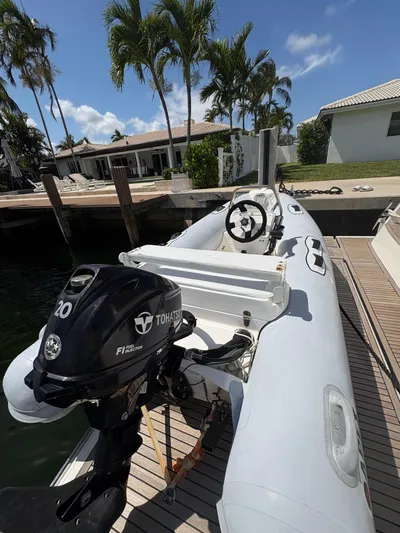  Yacht Photos Pics 2018 Prestige 680 inflatable boat docked, featuring a Tohatsu 20 HP outboard motor.
