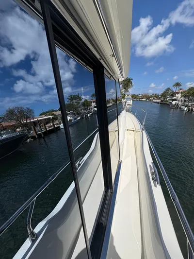  Yacht Photos Pics 2018 Prestige 680 yacht on a sunny day, docked in a serene marina.