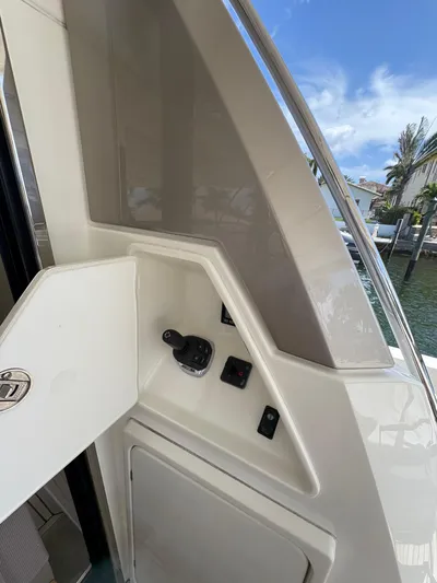 Yacht Photos Pics Control panel on a 2018 Prestige 680 yacht, featuring sleek design and waterfront view.