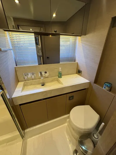  Yacht Photos Pics Luxurious bathroom in a 2018 Prestige 680 yacht with modern fixtures and elegant design.