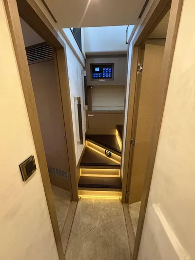  Yacht Photos Pics Interior of 2018 Prestige 680 yacht with modern staircase and ambient lighting.