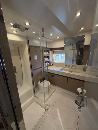  Yacht Photos Pics Luxurious bathroom in a 2018 Prestige 680 yacht with modern fixtures and elegant design.